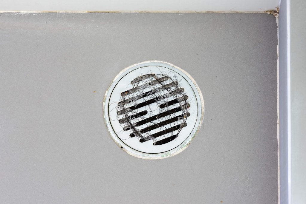 Is Your Shower Drain Clogged with Hair? Here's What to Do