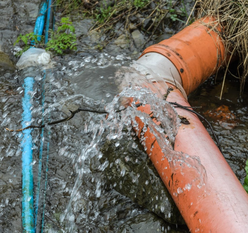 Deformed water pipe burst water flowing out of it